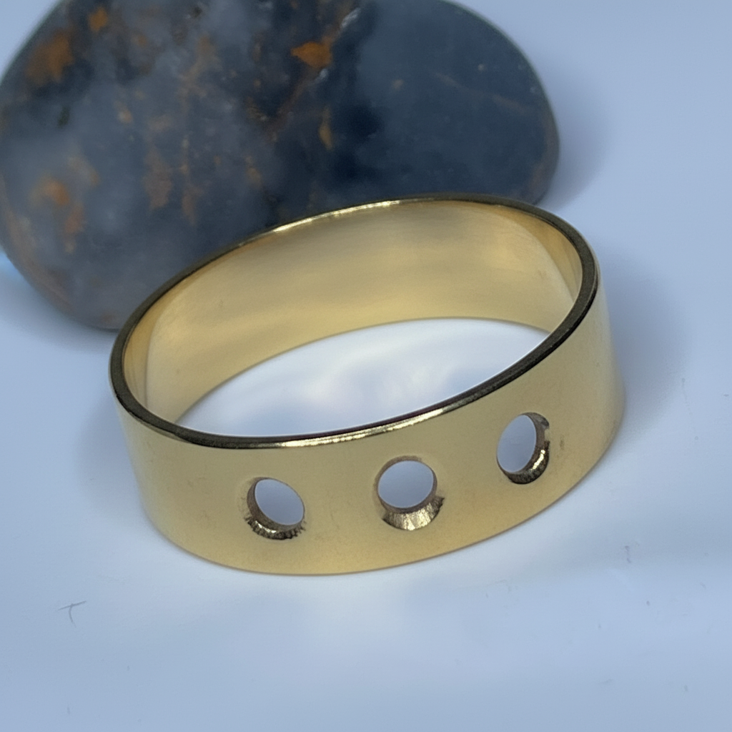 Yellow brass ring with 3 cut circles